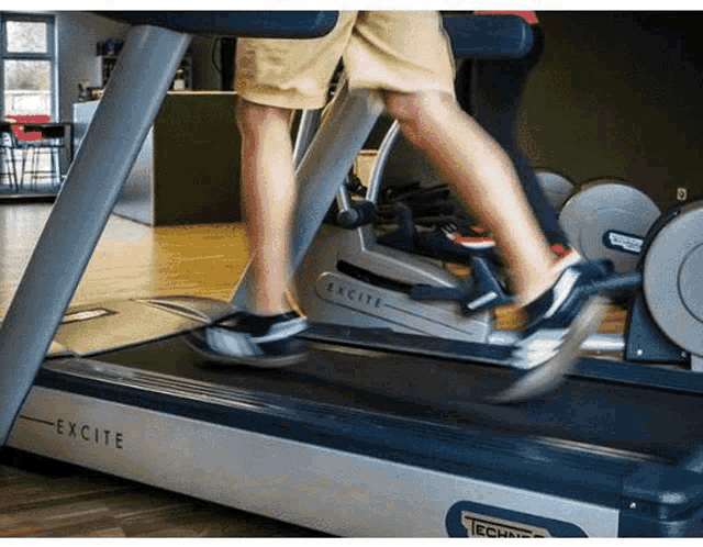 a person is running on a treadmill that says excite on it