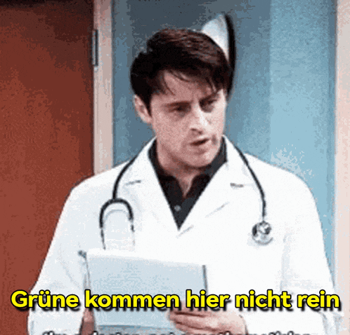 a doctor with a stethoscope around his neck is holding a piece of paper and says grune kommen hier nicht rein