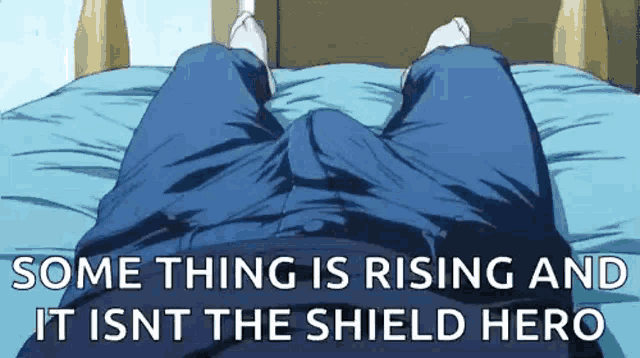 a person is laying on a bed with their legs crossed and their pants are visible .