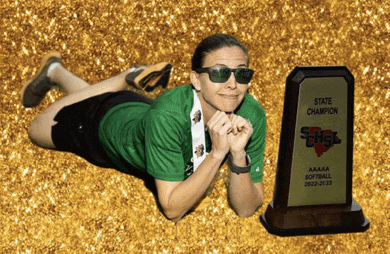 a woman is laying on the ground next to a state champion trophy