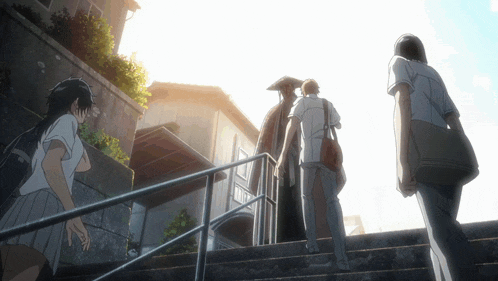 a group of people walking up a set of stairs in front of a house