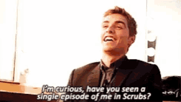 a man in a suit is talking about a single episode of scrubs