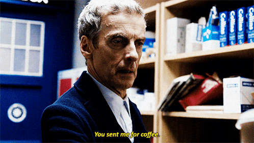 a man says you sent me for coffee in front of a blue door