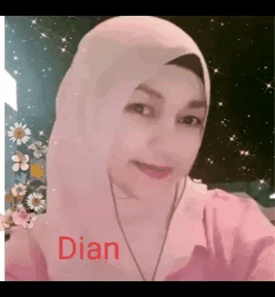 a woman wearing a pink hijab and a pink shirt with the name dian written on it .