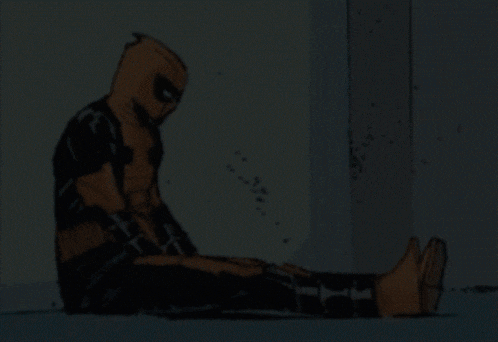a cartoon of deadpool sitting on the ground with his head down