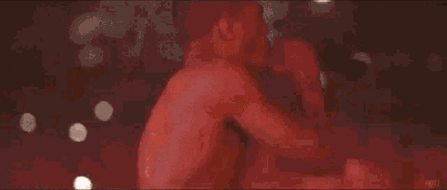 a close up of a red background with a few white dots on it
