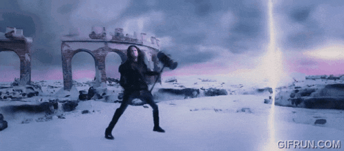 a gif from gifrun.com shows a person holding a hammer