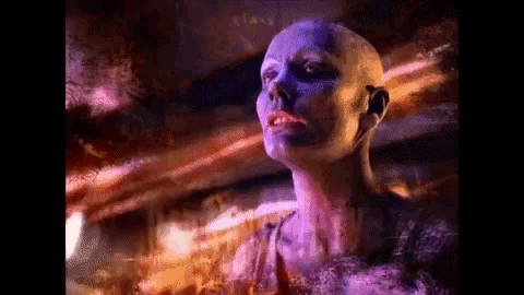 a painting of a woman with purple paint on her face and a purple background