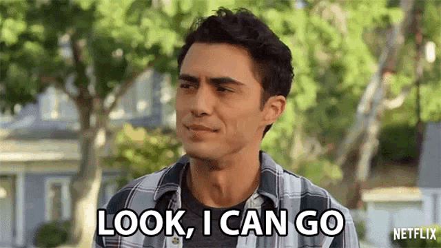 a man in a plaid shirt is saying look , i can go netflix .