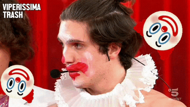 a man in a clown costume has a microphone in his mouth and viperissima trash written on the bottom