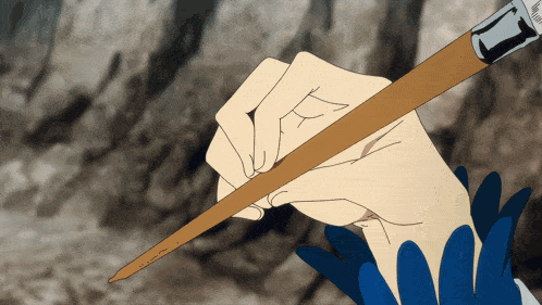 a person is holding a brush with the letter t on it