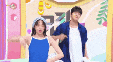 a man and a woman are dancing on a stage in front of a sign that says ' icc '
