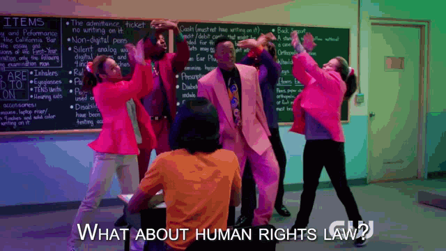 a group of people are dancing in front of a chalkboard that says items