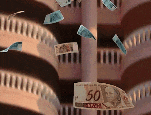 a 50 reais bill is hanging from a pole