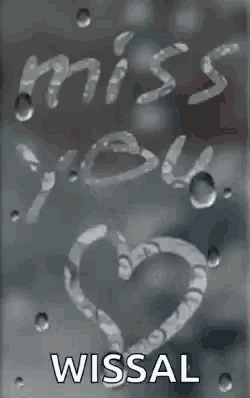 a heart with the words `` miss you '' written on it .