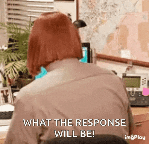 a woman sitting at a desk with the words what the response will be on the bottom