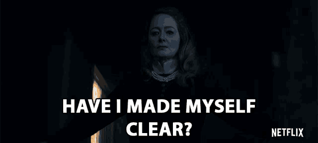 a woman in a dark room with the words " have i made myself clear "