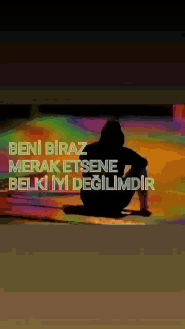 a silhouette of a person with the words beni biraz merak etsene belki iyi degilimdir