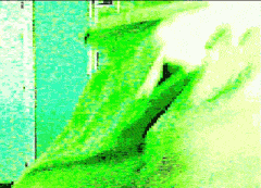 a green background with a lot of pixels and a person in a green shirt