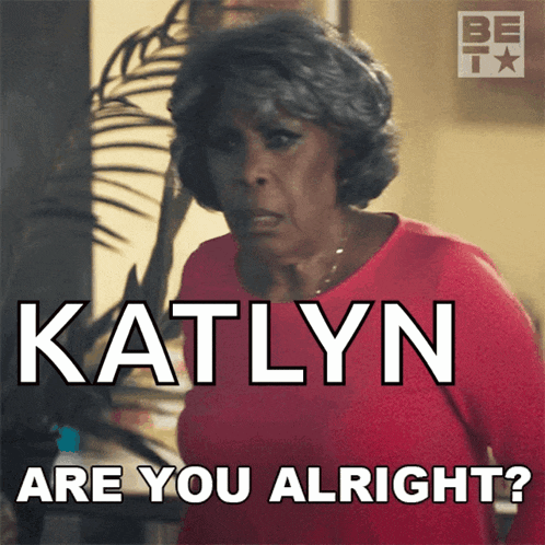 a woman in a red shirt with katlyn are you alright written on it