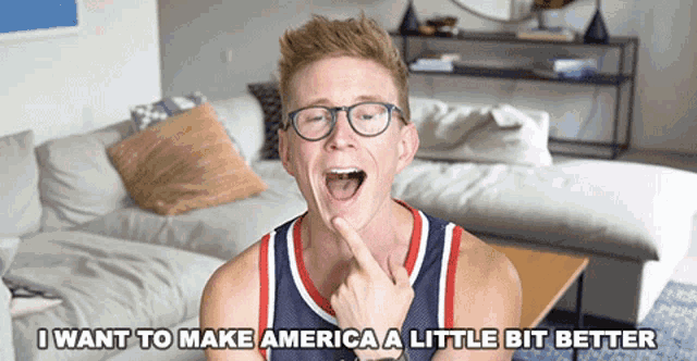 a man wearing glasses and a basketball jersey says i want to make america a little bit better