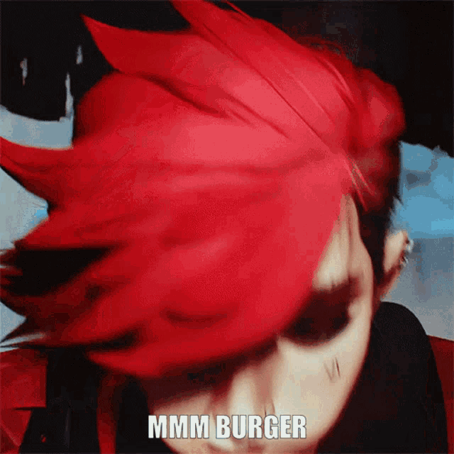 a close up of a person 's face with red hair and the words mmmm burger below it