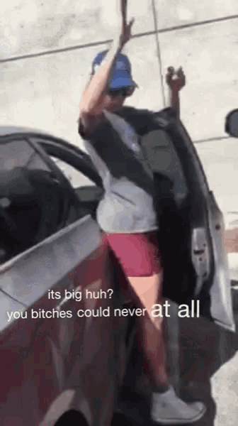 a woman getting out of a car with a caption that says its big huh you bitches could never at all