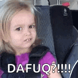 a little girl is sitting in a car seat with a funny face .
