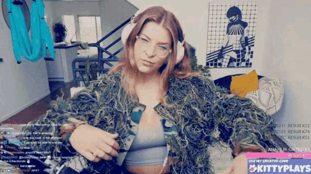 a woman wearing headphones and a fur coat is on a kittyplays twitch channel