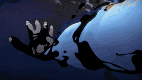 a person 's hand is reaching out towards a blue background
