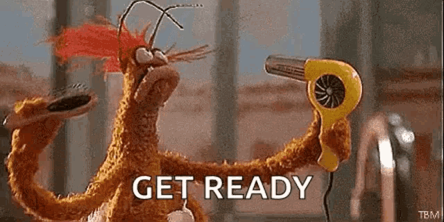 a stuffed animal is blow drying its hair with a hair dryer and the words `` get ready '' .