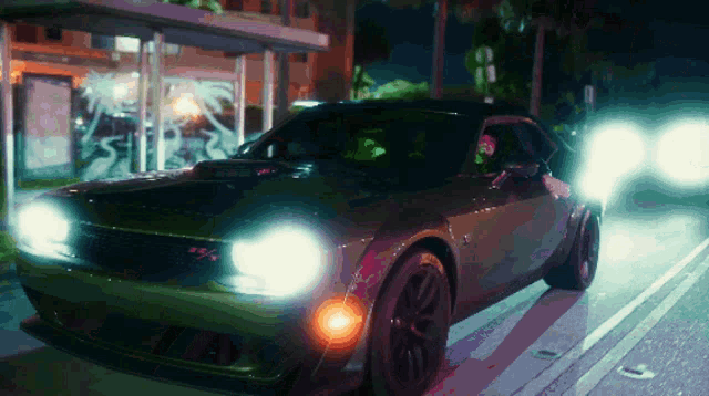 a dodge challenger is parked in front of a bus stop