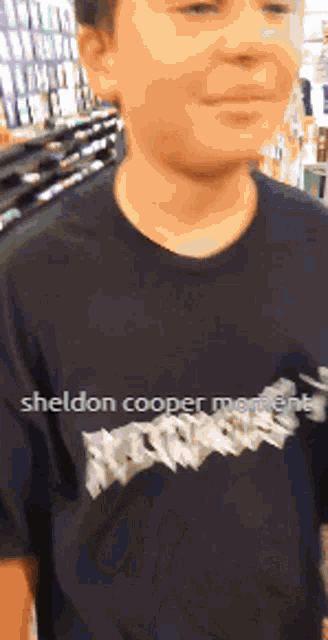 a boy wearing a sheldon cooper moment shirt