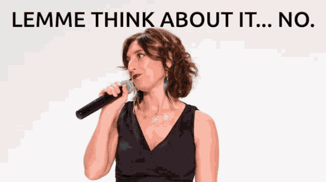 a woman singing into a microphone with the words " lemme think about it ... no " behind her