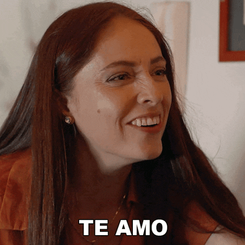 a woman is smiling and says te amo on the bottom