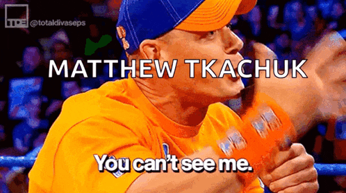 a man wearing a yellow shirt and a blue hat says matthew tkachuk you can 't see me .
