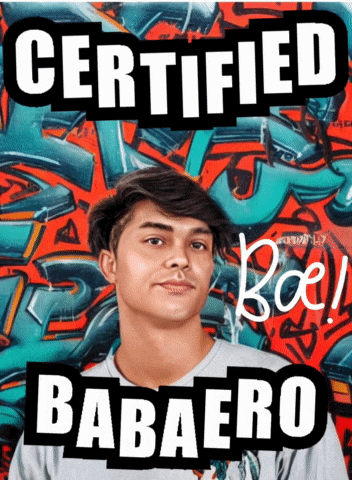 a young man is standing in front of a graffiti wall with the words certified babaero