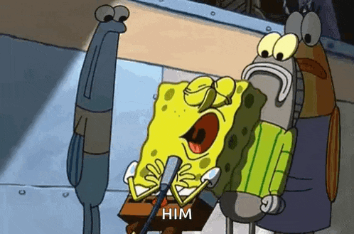 spongebob squarepants is sitting at a podium holding a microphone and talking to a man .