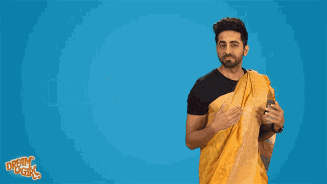 a man in a yellow sari says gossip