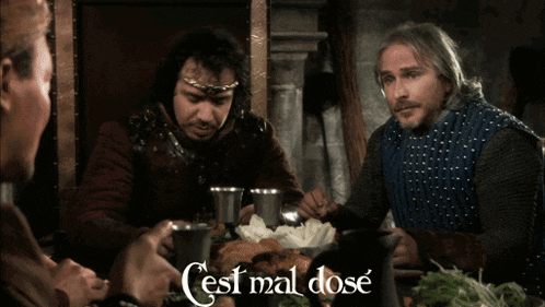 a group of men are sitting around a table with the words cest mal dose written on the bottom