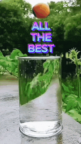 a glass of water with the words " all the best " on top of it