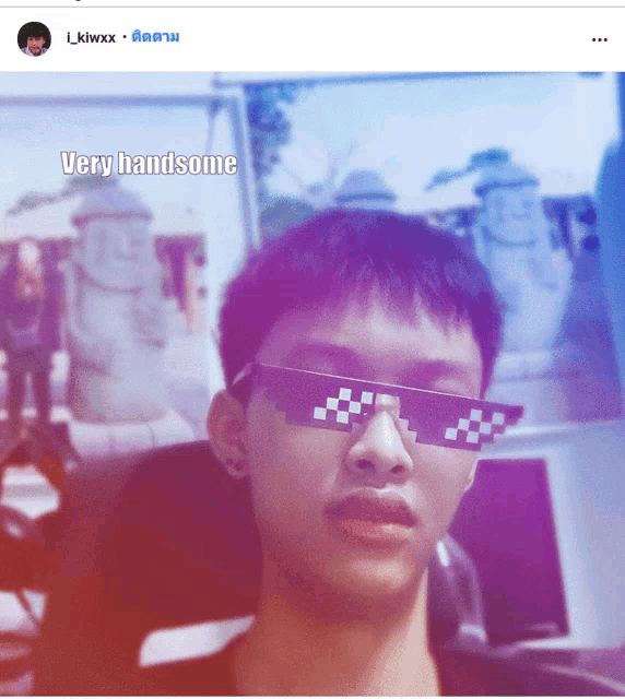 a picture of a man wearing sunglasses with a caption that says " very handsome "