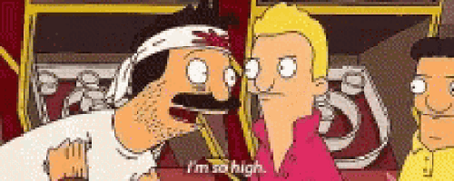 a man with a bandage on his head is talking to another man .