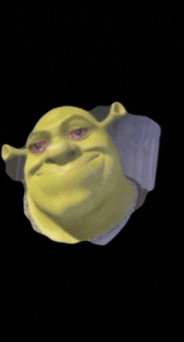 shrek 's face is visible through a hole in a wall
