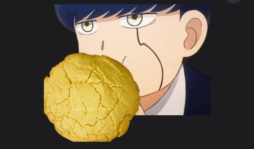 a close up of a person eating a cookie with a black background