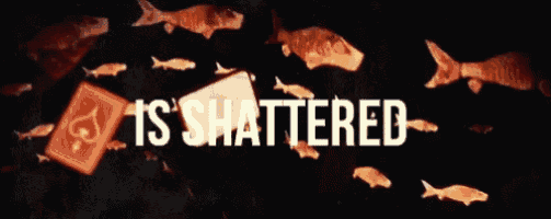 a group of fish are swimming around playing cards that say is shattered