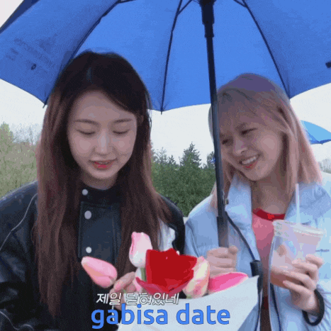 two girls under an umbrella with the word gabisa date in the corner