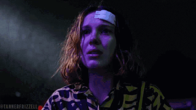 a close up of a woman with a bandage on her forehead and the words tanner frizzelli below her
