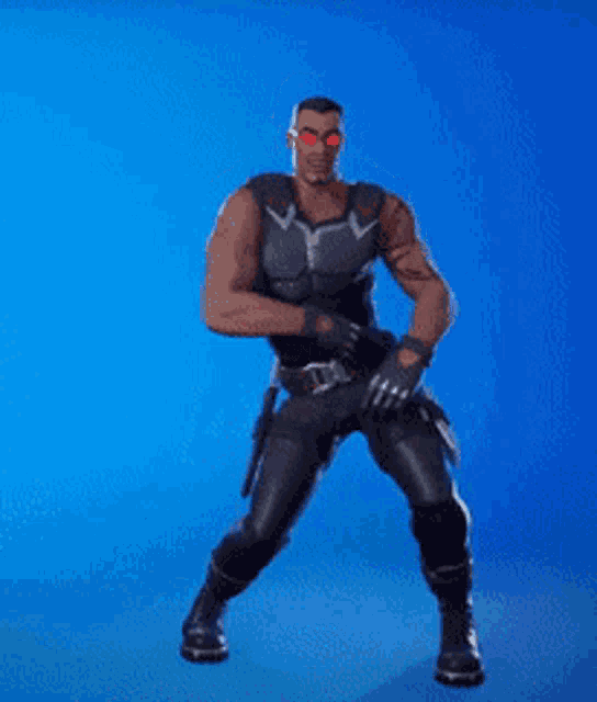 a man in a superhero costume is standing on a blue background and pointing .