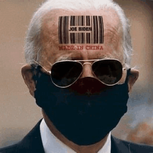 joe biden is wearing a face mask and sunglasses and has a barcode on his forehead .